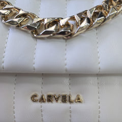 Close-up of a white handbag with gold chain detail and 'Carvela' branding.