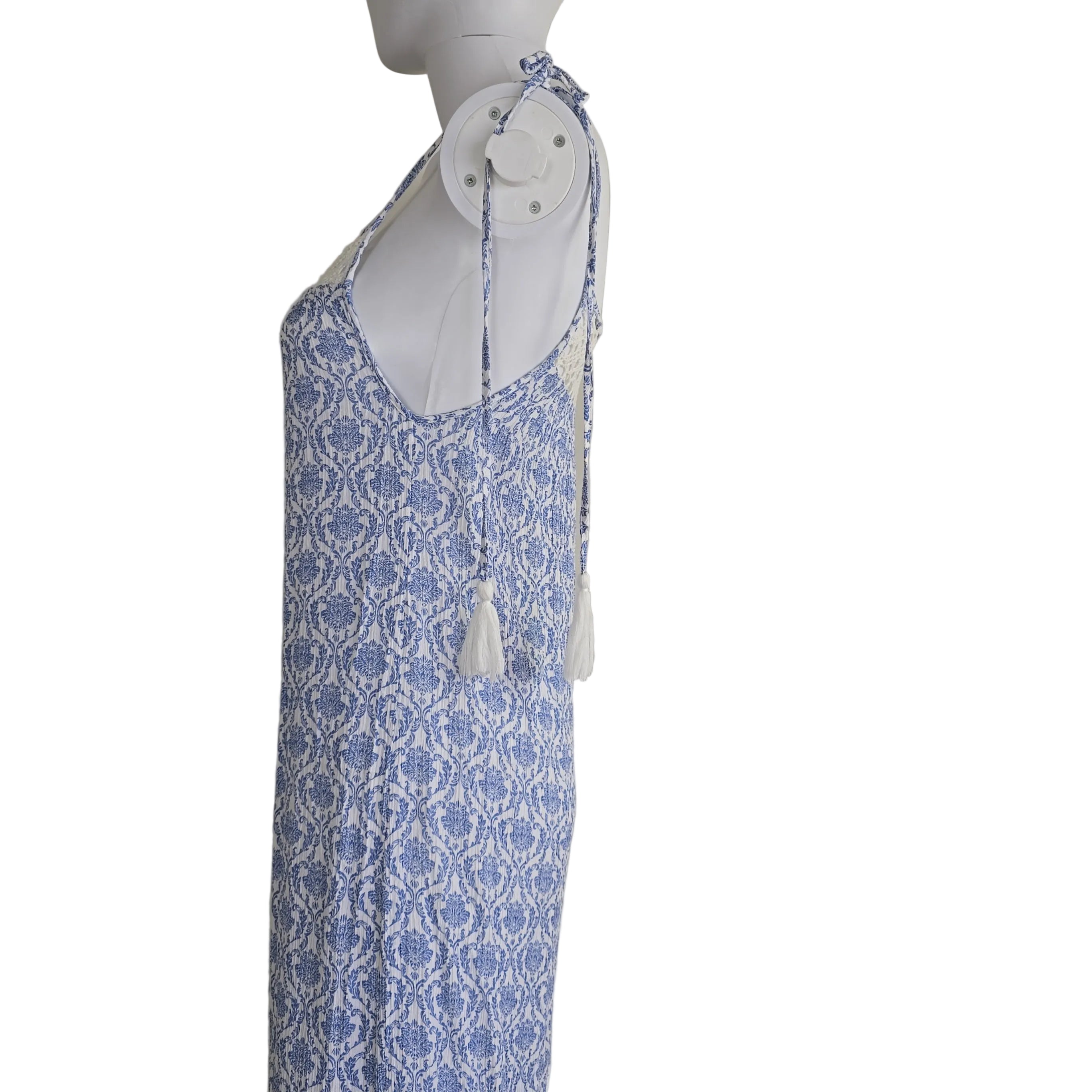 Blue and white patterned dress on a light background