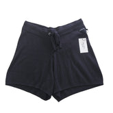 Black Cotton Shorts with a Calvin Klein label on a light background.