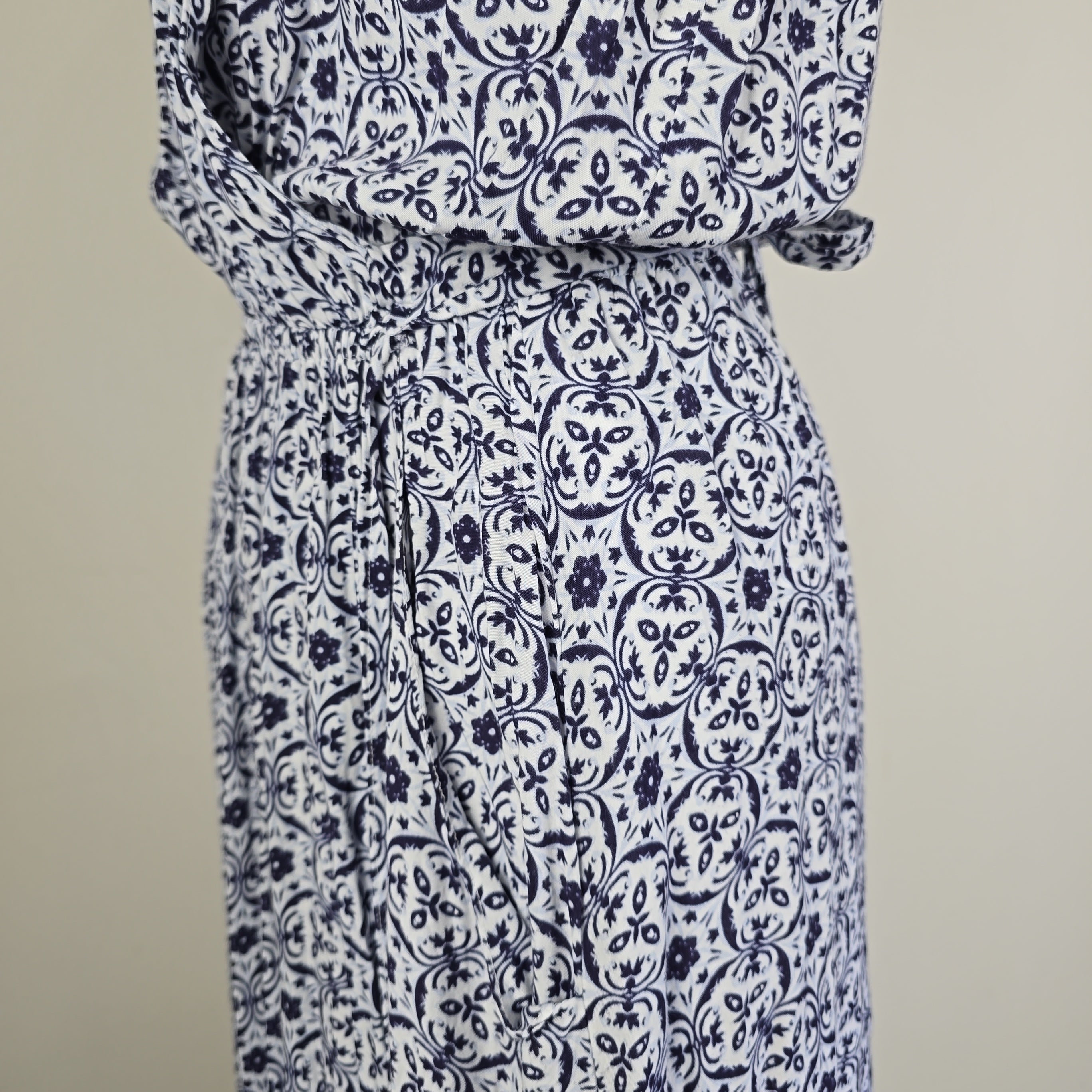 Blue and white patterned fabric on a plain background