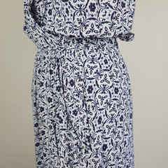 Blue and white patterned fabric on a plain background