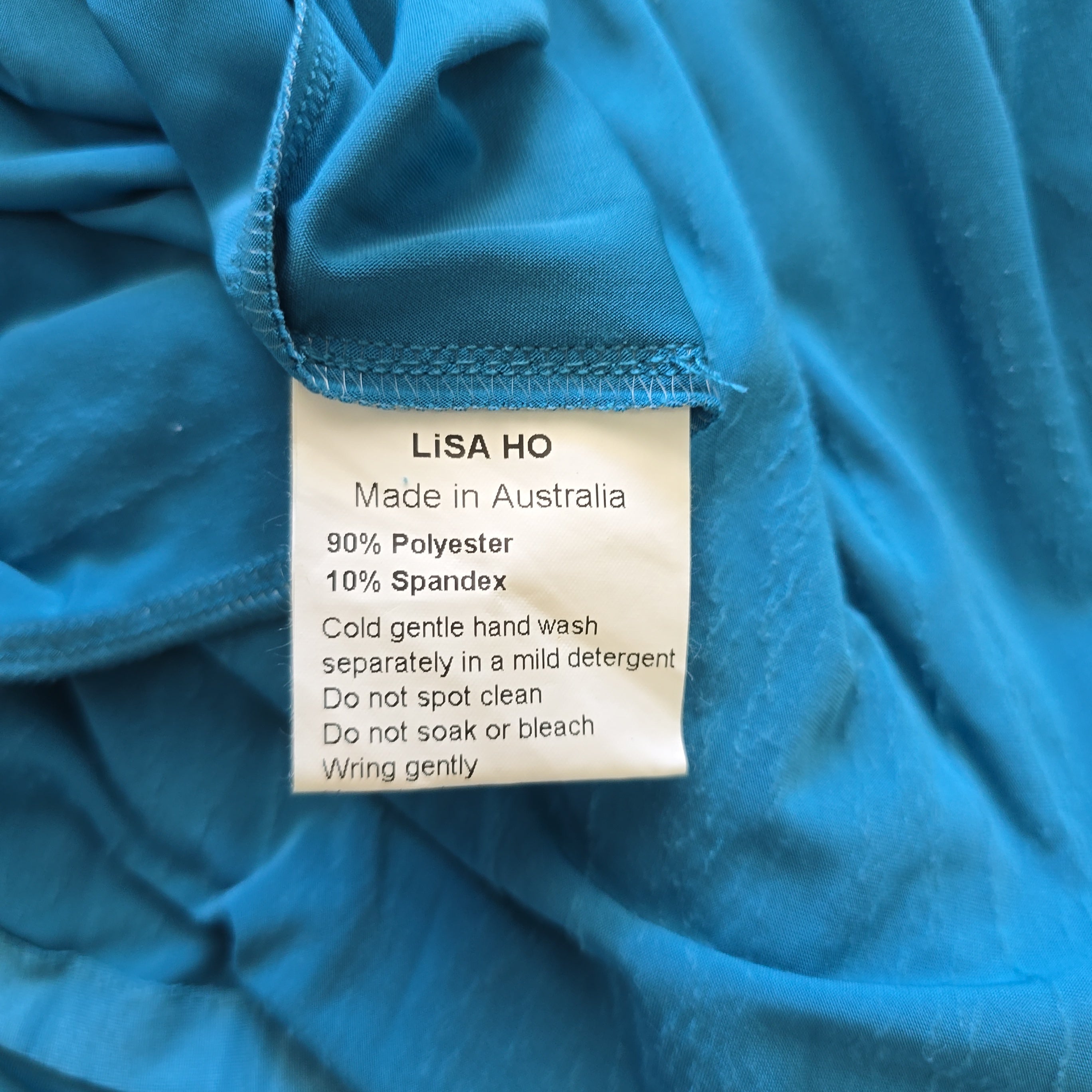 Close-up of a blue fabric with a Lisa Ho label.