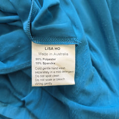 Close-up of a blue fabric with a Lisa Ho label.