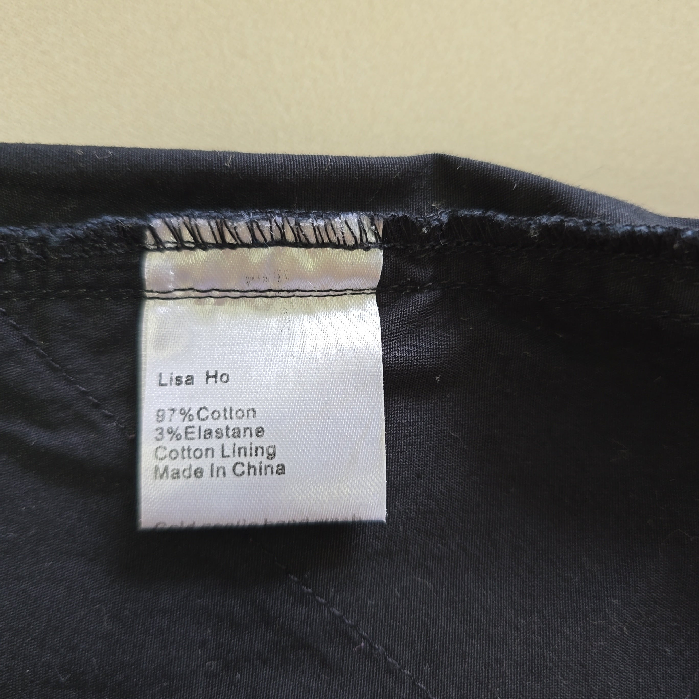 Label on a black garment with text details