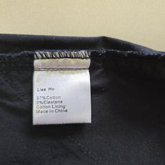 Label on a black garment with text details