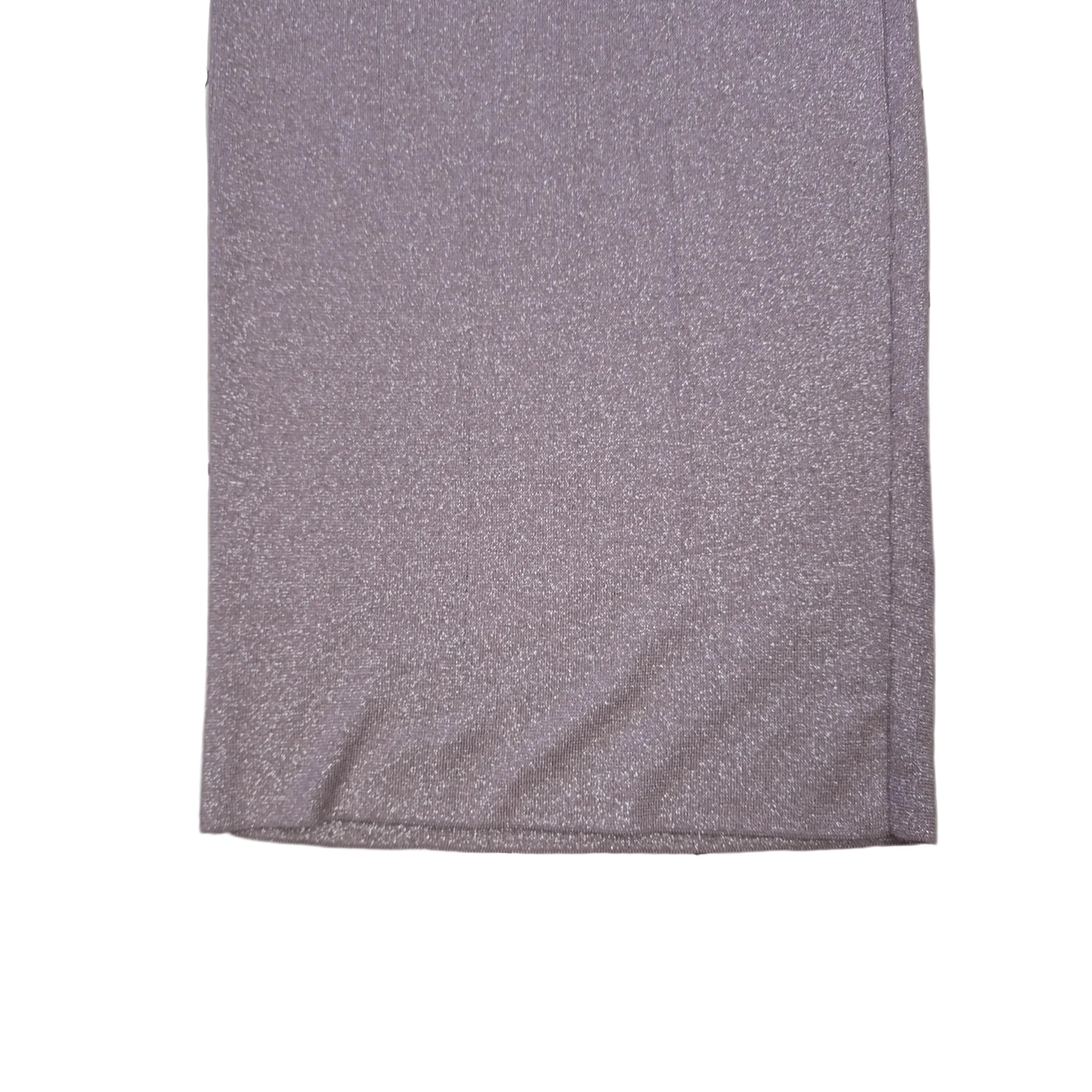 Plum coloured dress with silver details on a light background