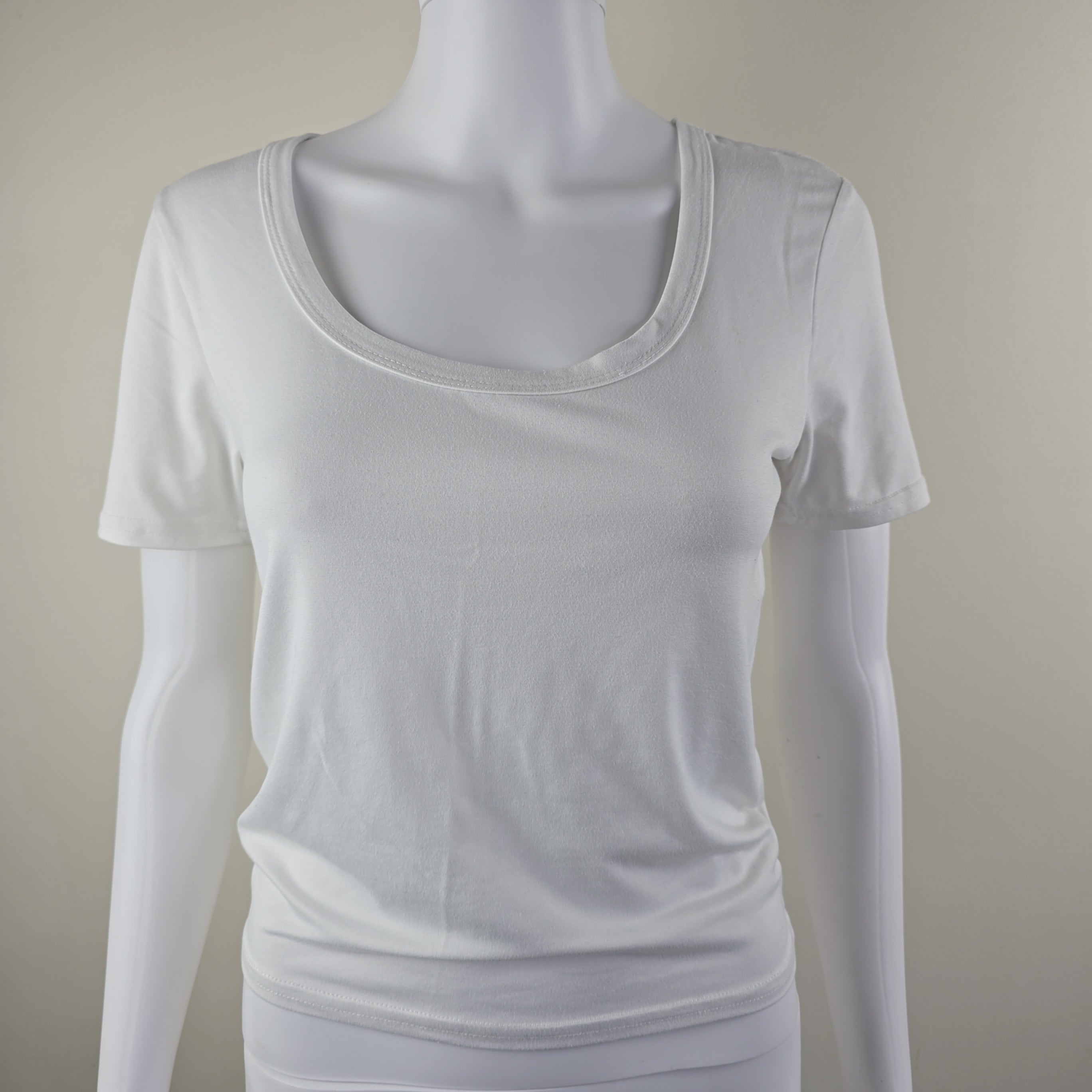 White tank top on a beige background