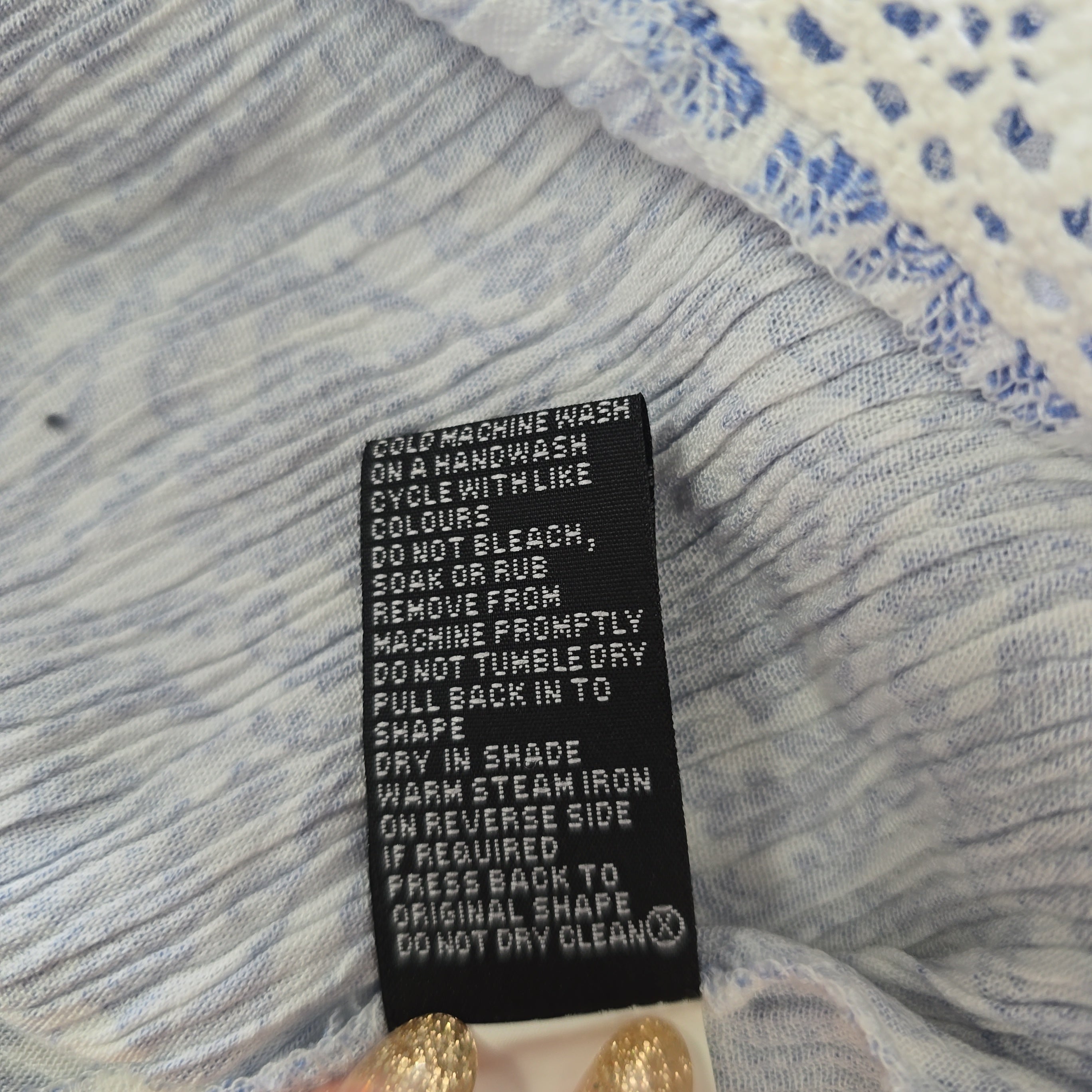 Clothing label on a textured fabric background