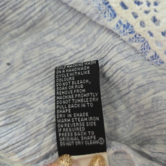 Clothing label on a textured fabric background