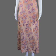 Floral-patterned fabric against a white wall.