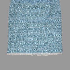 Blue textured skirt on a tiled floor