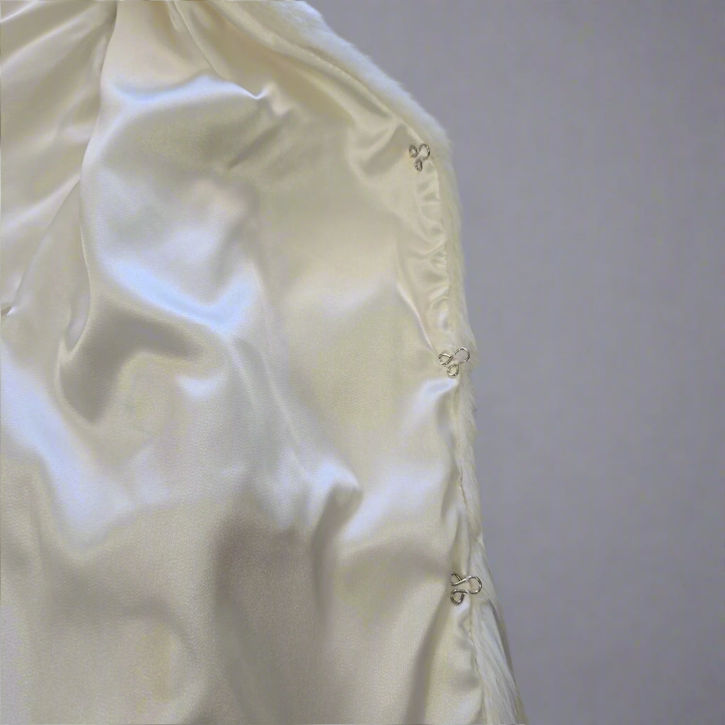 White satin fabric on a tiled floor