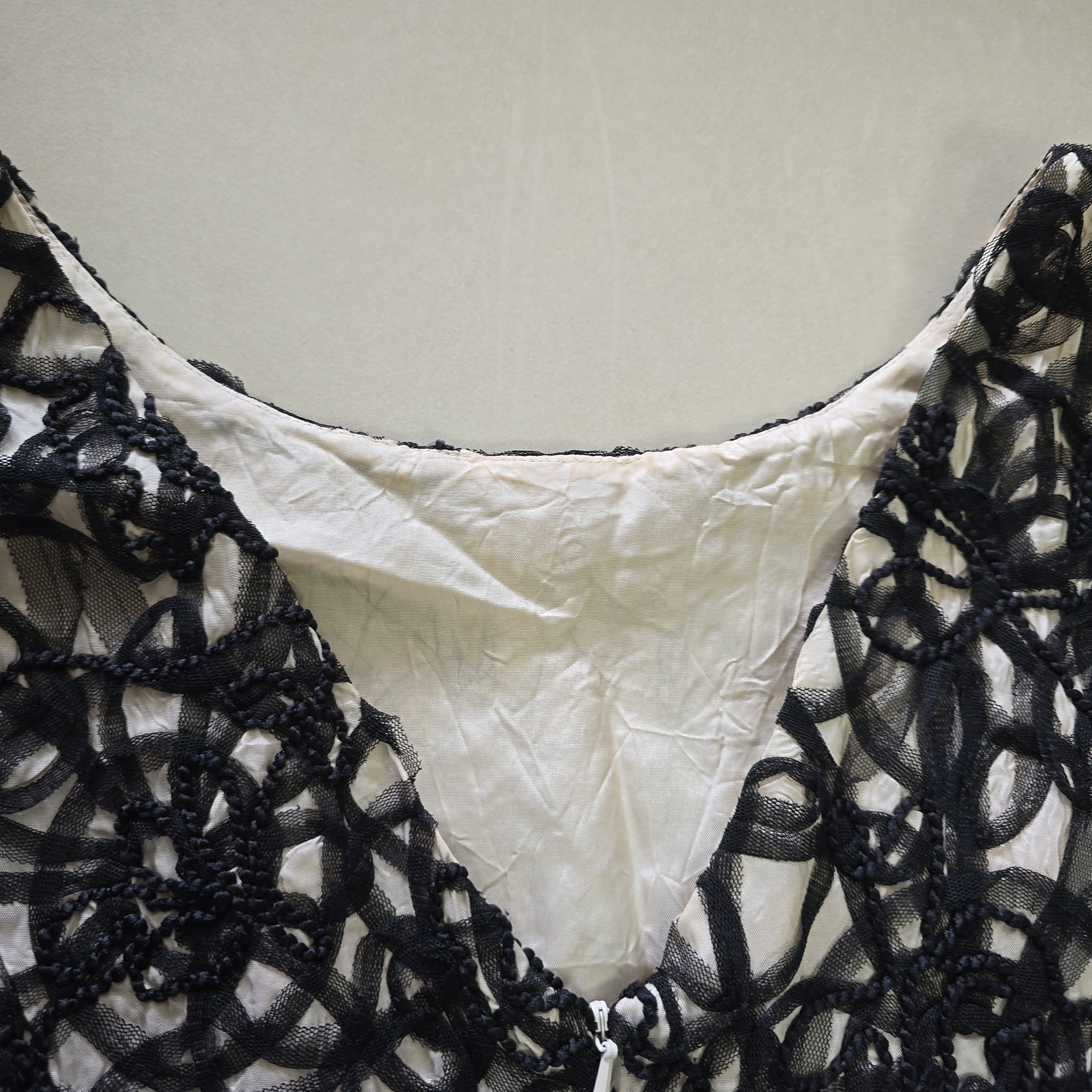 Black lace lingerie on a light gray background