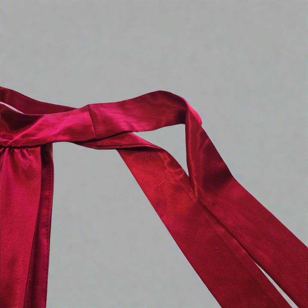 Red fabric draped over a tiled floor