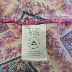Fabric label with floral pattern on a piece of fabric