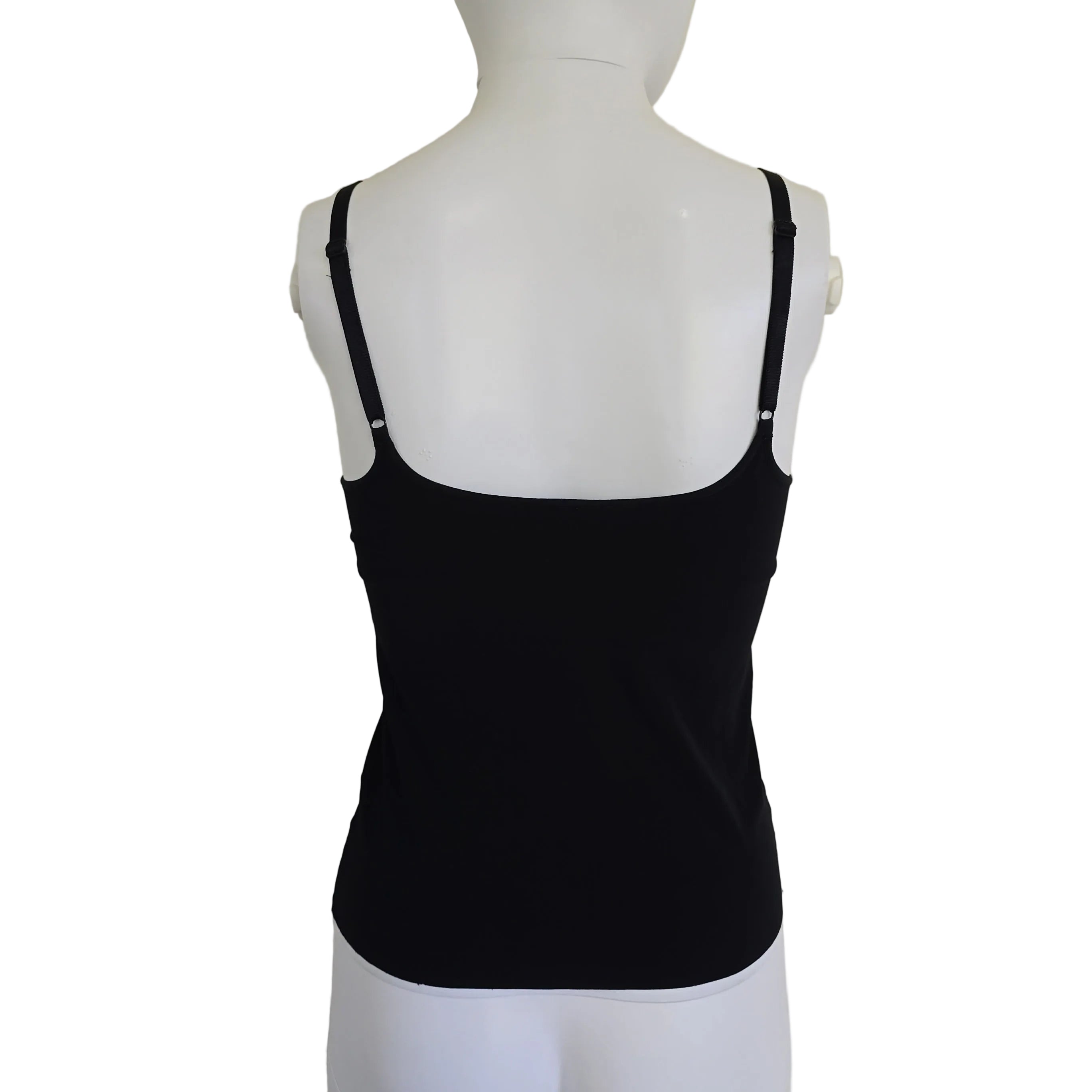 Black top on a mannequin against a light background