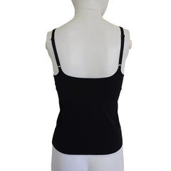 Black top on a mannequin against a light background