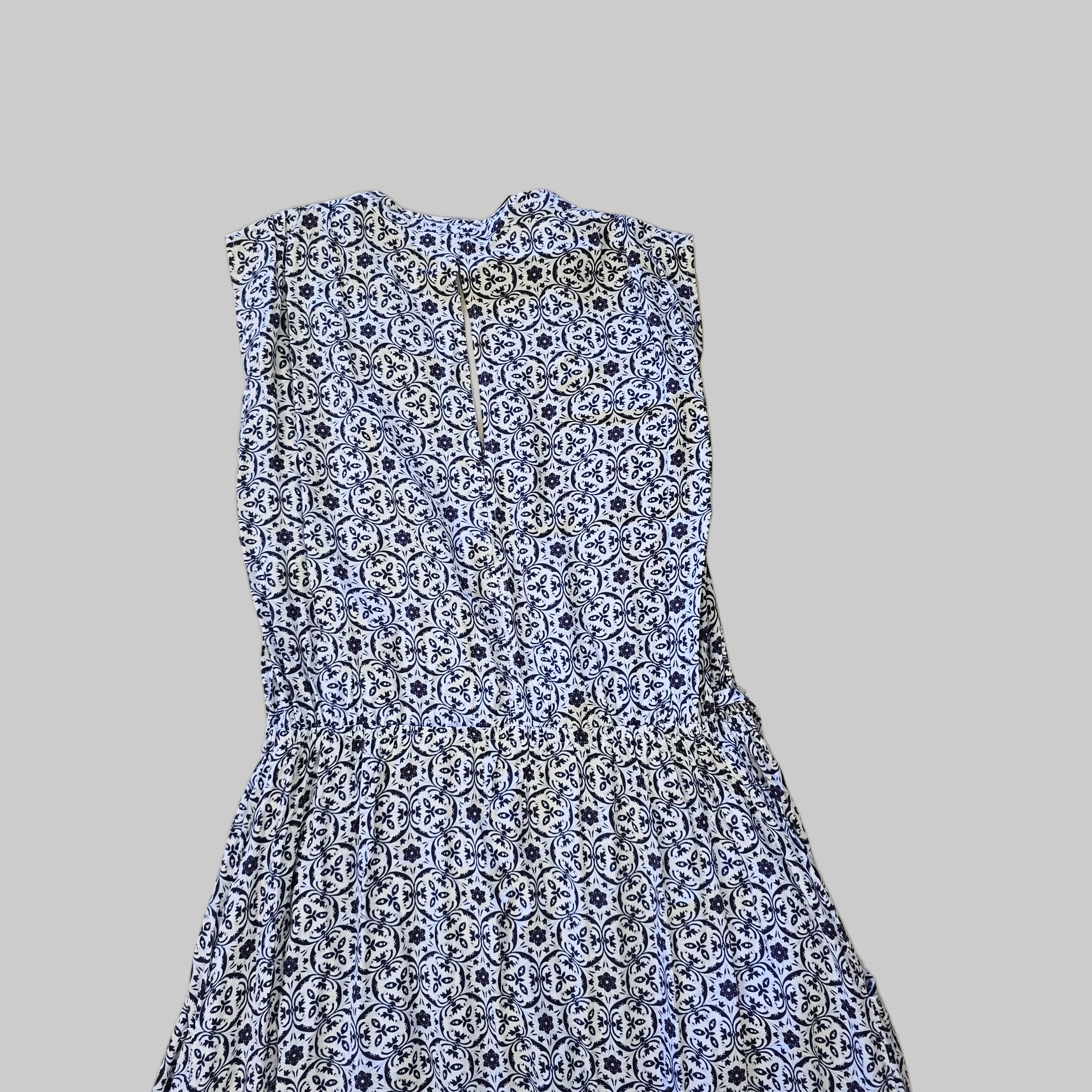 Blue and white patterned fabric on a tiled floor