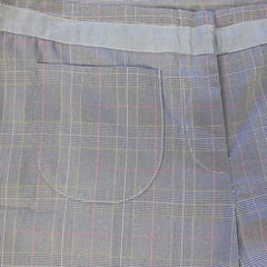Close-up of a gray plaid fabric with a pocket detail