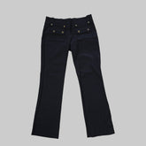 Black pants on a white tiled floor