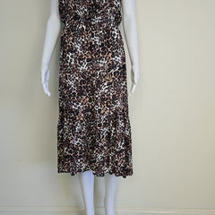 Leopard print top on a mannequin against a plain background