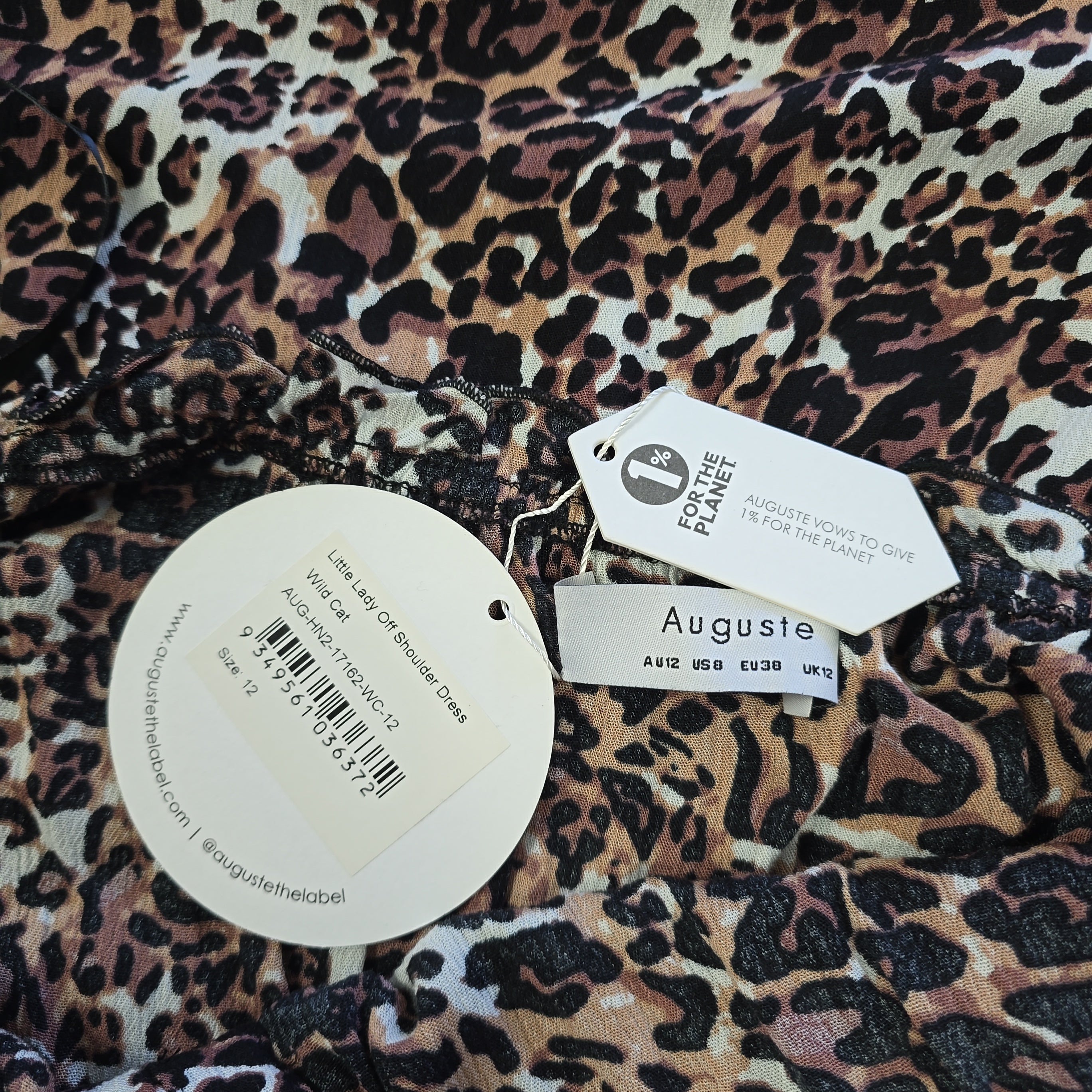 Leopard print fabric with Auguste label on a white background