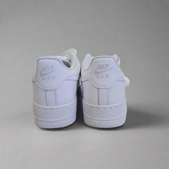 White Nike shoes on a light gray background