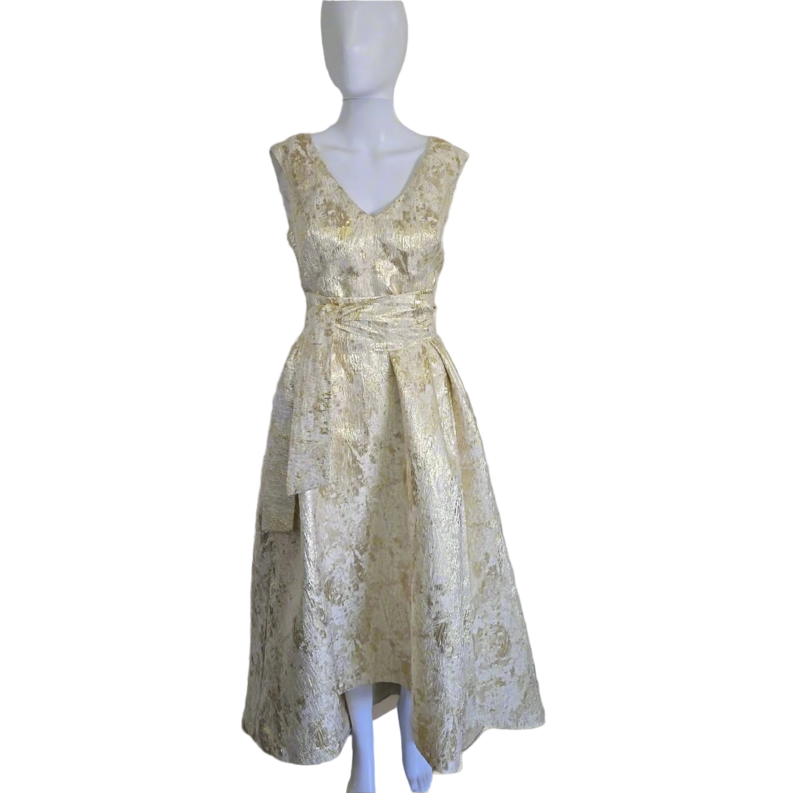 Eileen Kirby white and gold brocade dress with a high-low hemline and deep V-neckline on a mannequin against a neutral background.