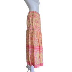 Colorful patterned skirt on a mannequin against a plain background