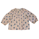 Floral-patterned flowy top on a light background