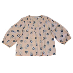 Floral-patterned flowy top on a light background