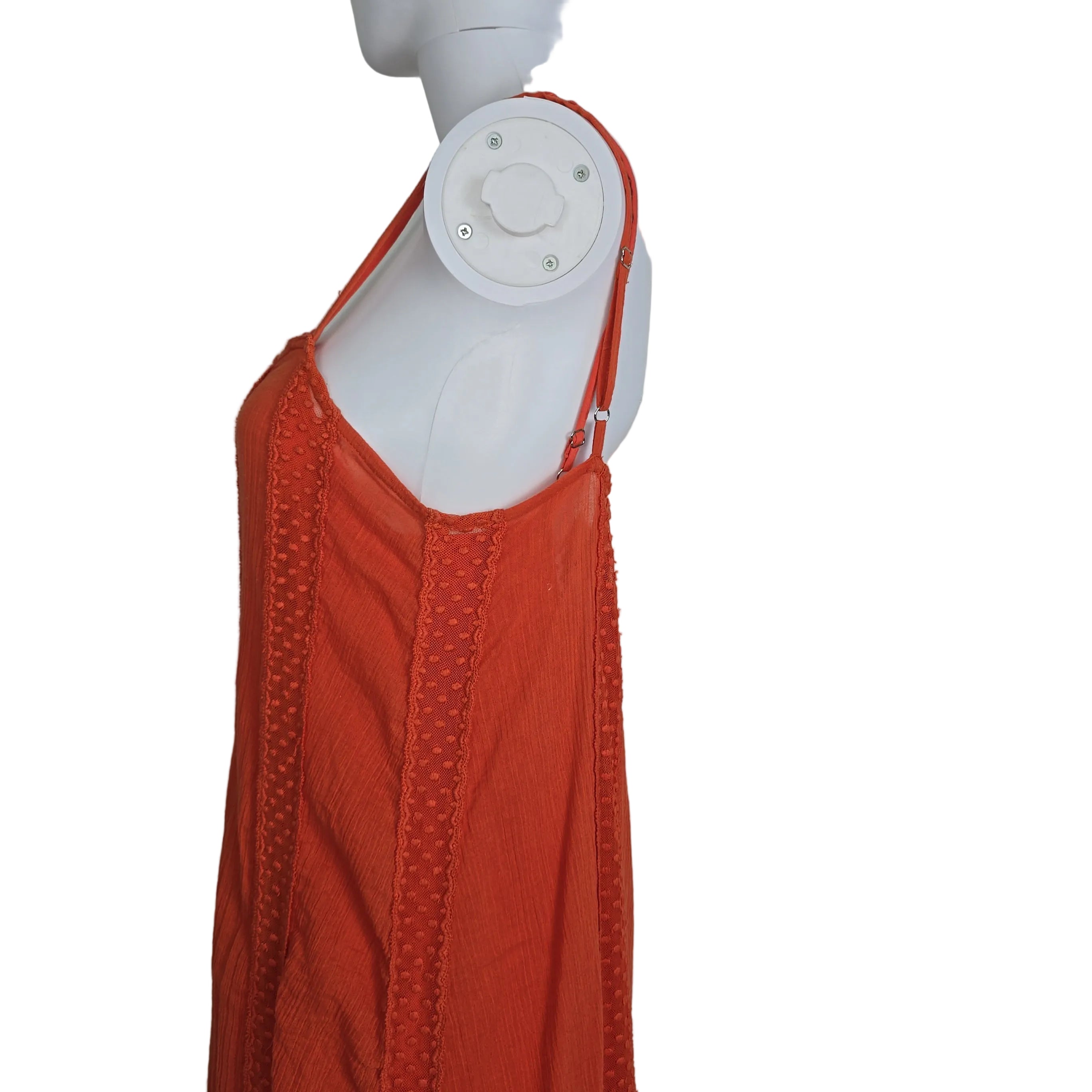 Orange dress with yellow embroidery on a light background