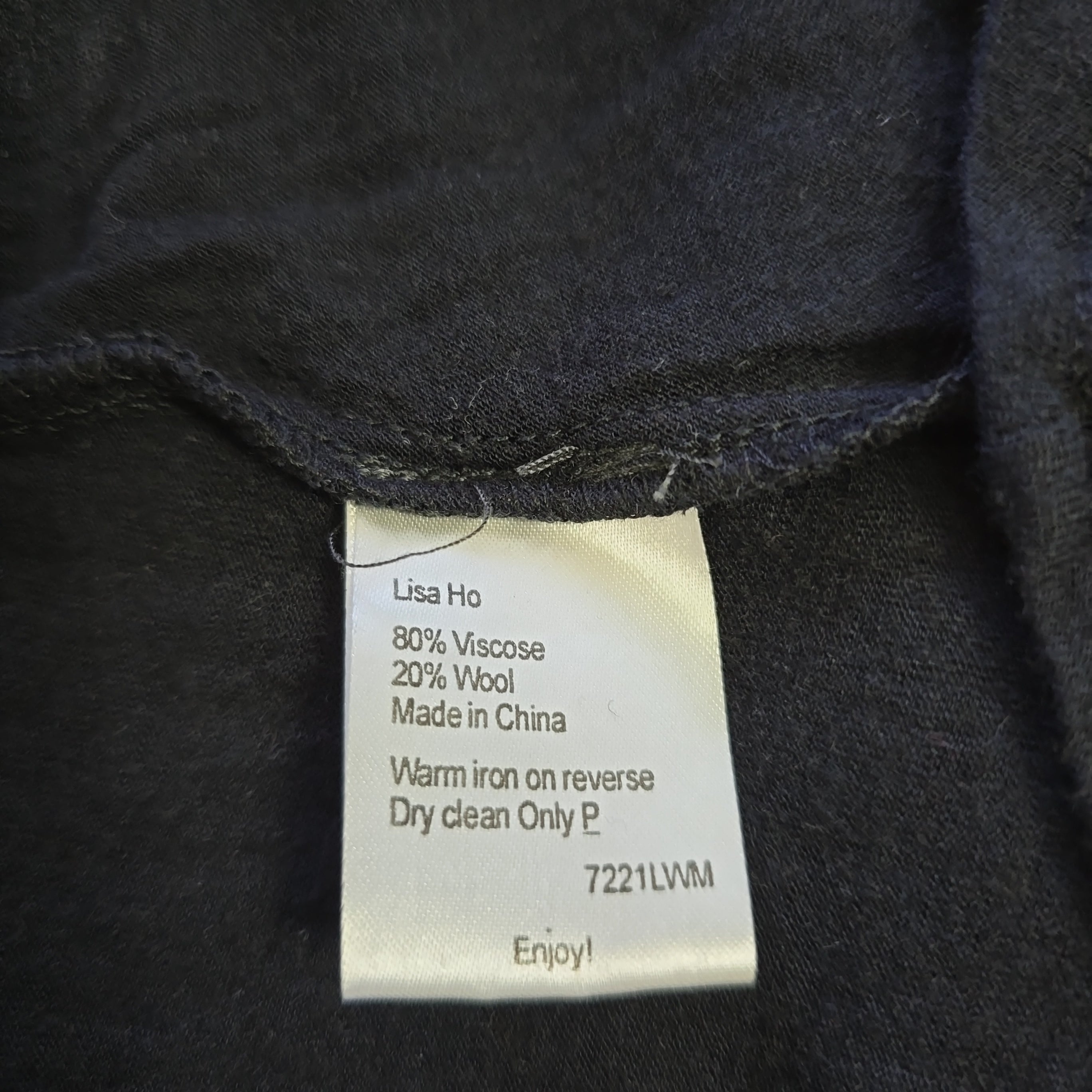 Clothing label on a dark fabric background
