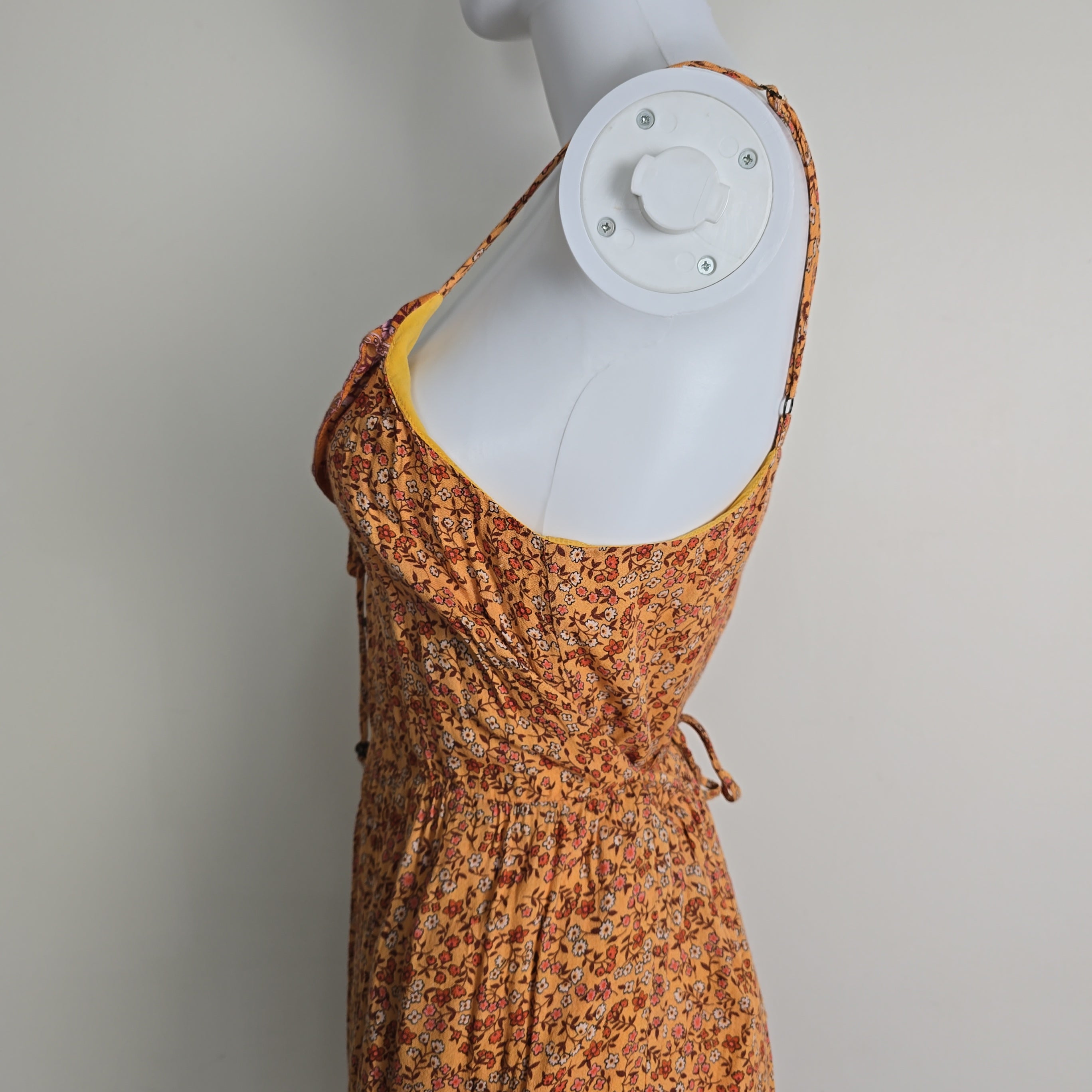 Orange patterned dress on a light background