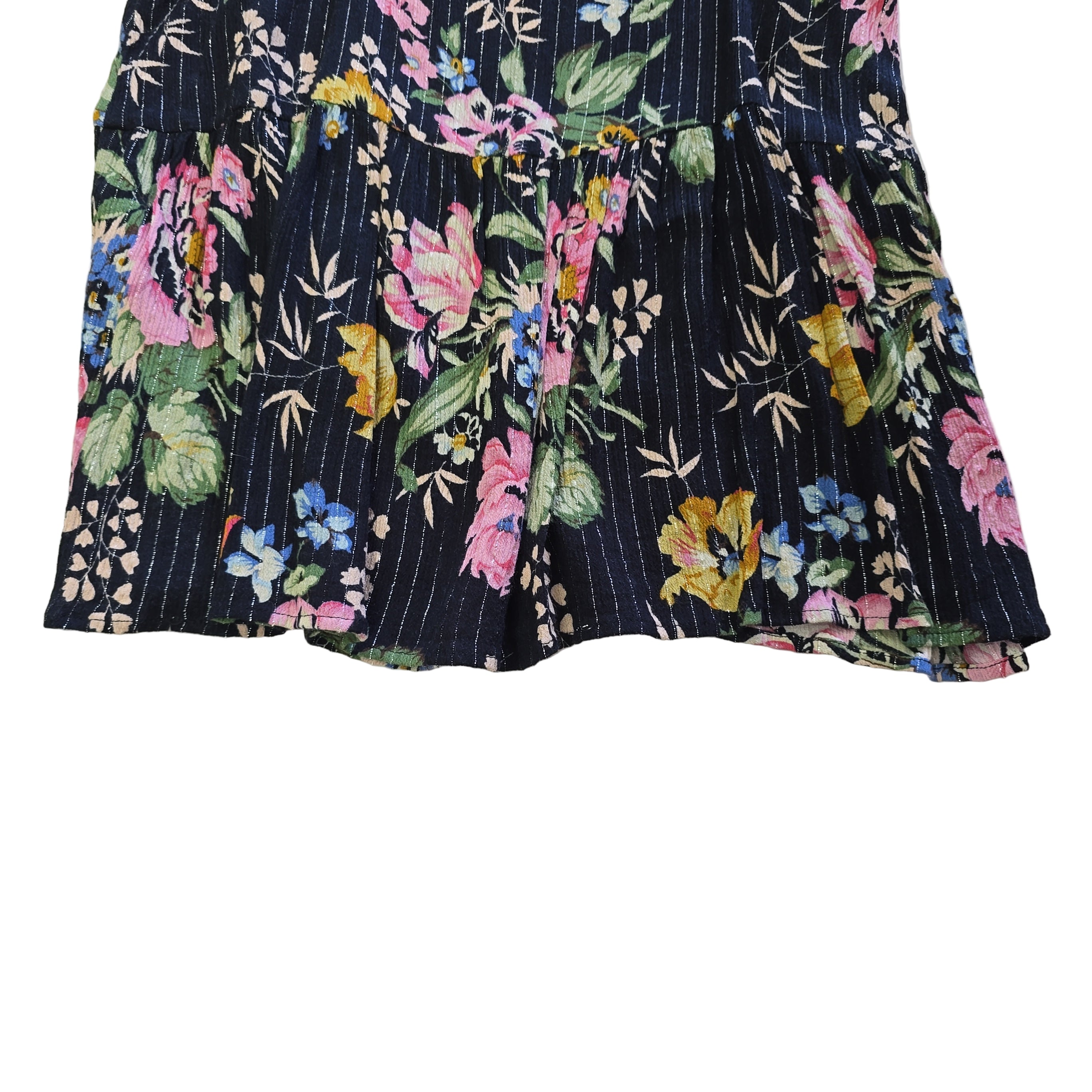 Black floral-patterned top on a light background