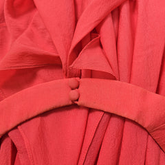 Close-up of a red fabric with pleated texture
