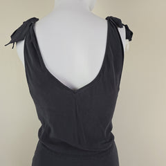 Grey sleeveless top on a mannequin against a beige background