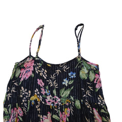 Black floral-patterned top on a light background