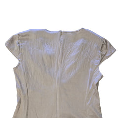 Light-colored sleeveless top on a light background