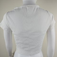 White top on a mannequin against a neutral background