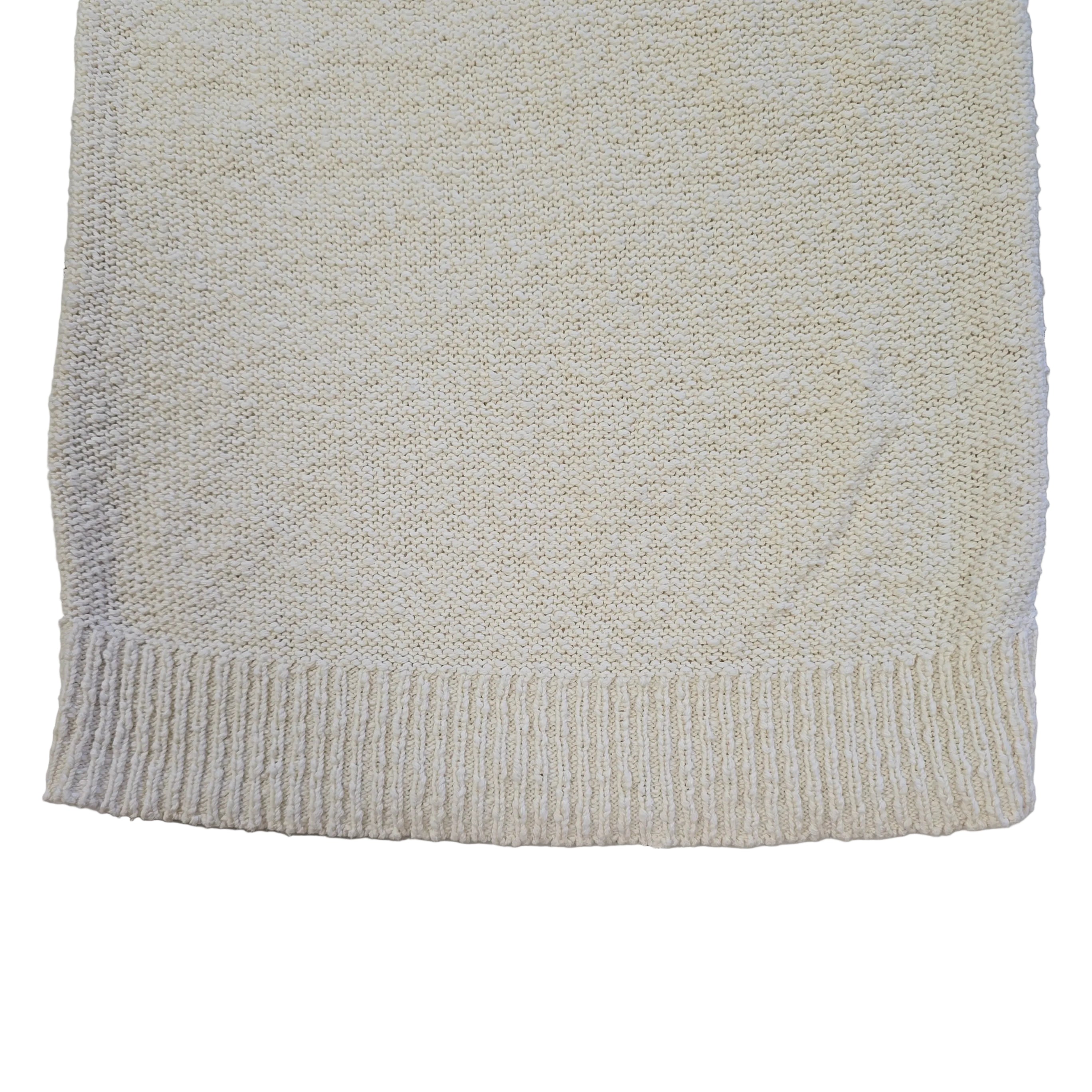 White knitted tank top on a light background