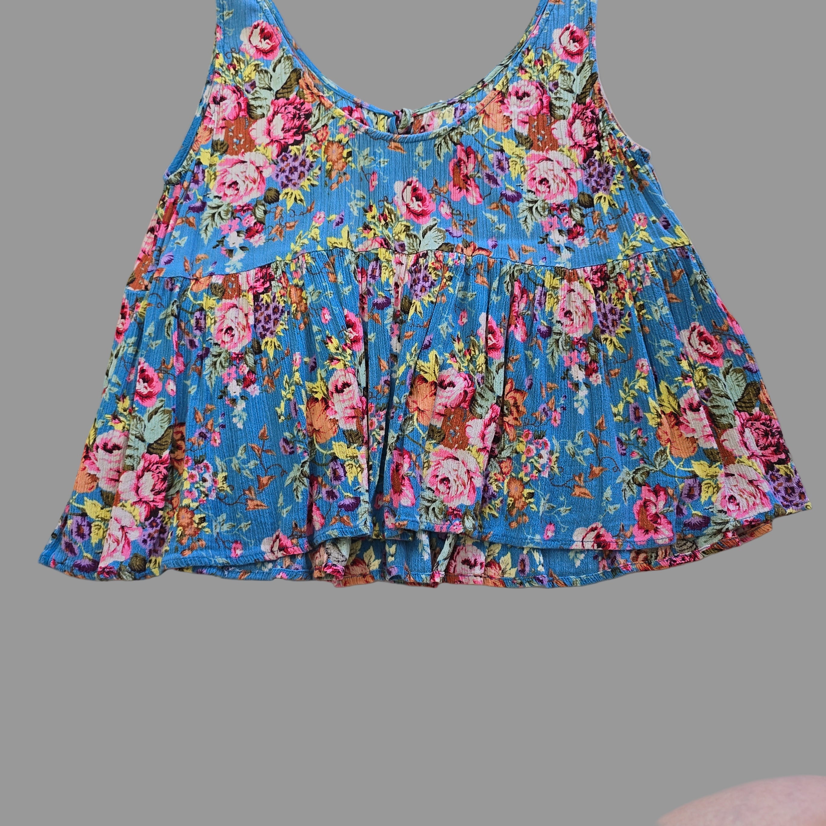 Blue floral top with on a light background