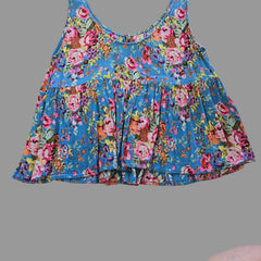 Blue floral top with on a light background