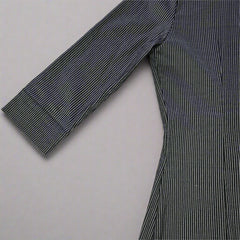 Dark blue striped shirt on a tiled floor