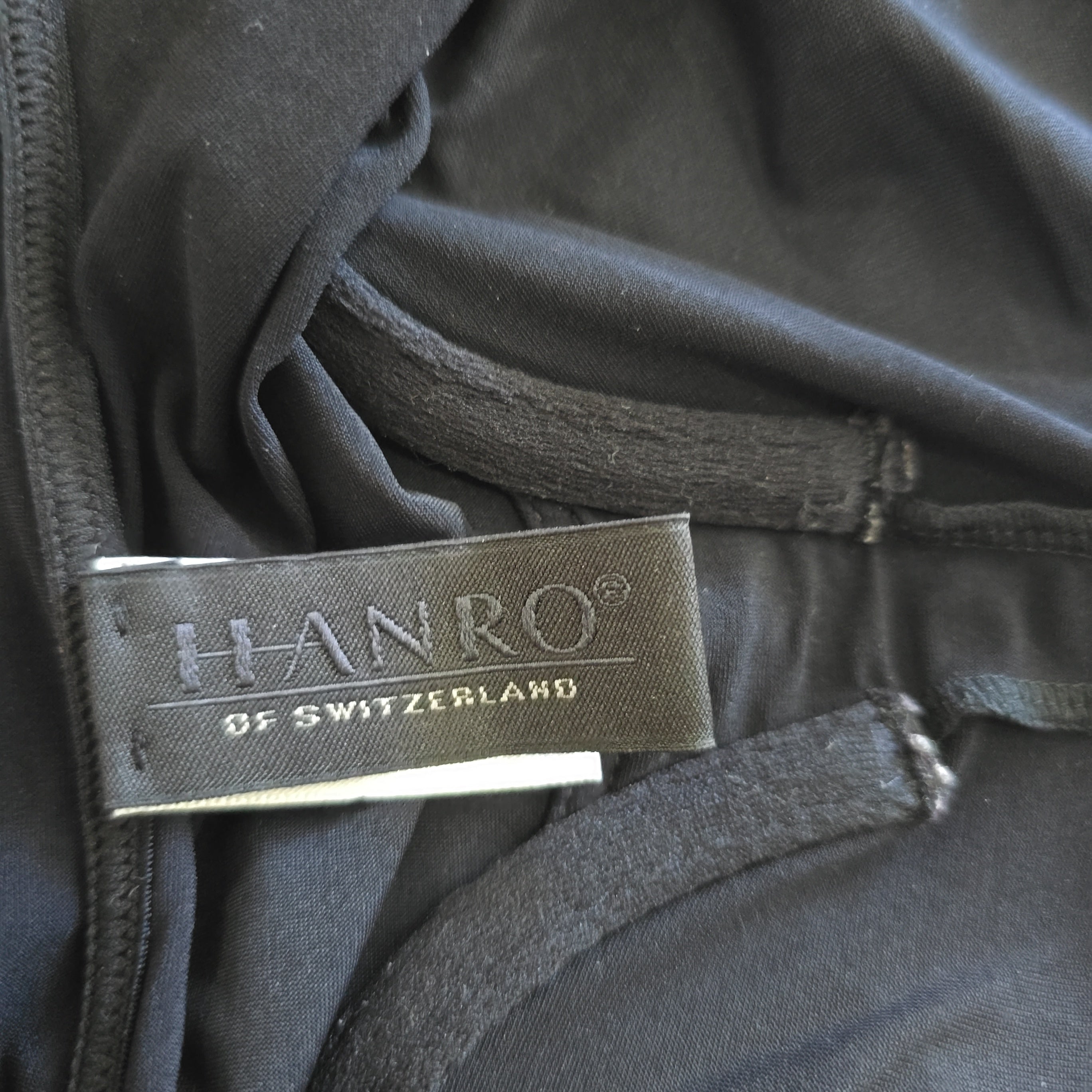 Close-up of a black garment with a HANRO label.