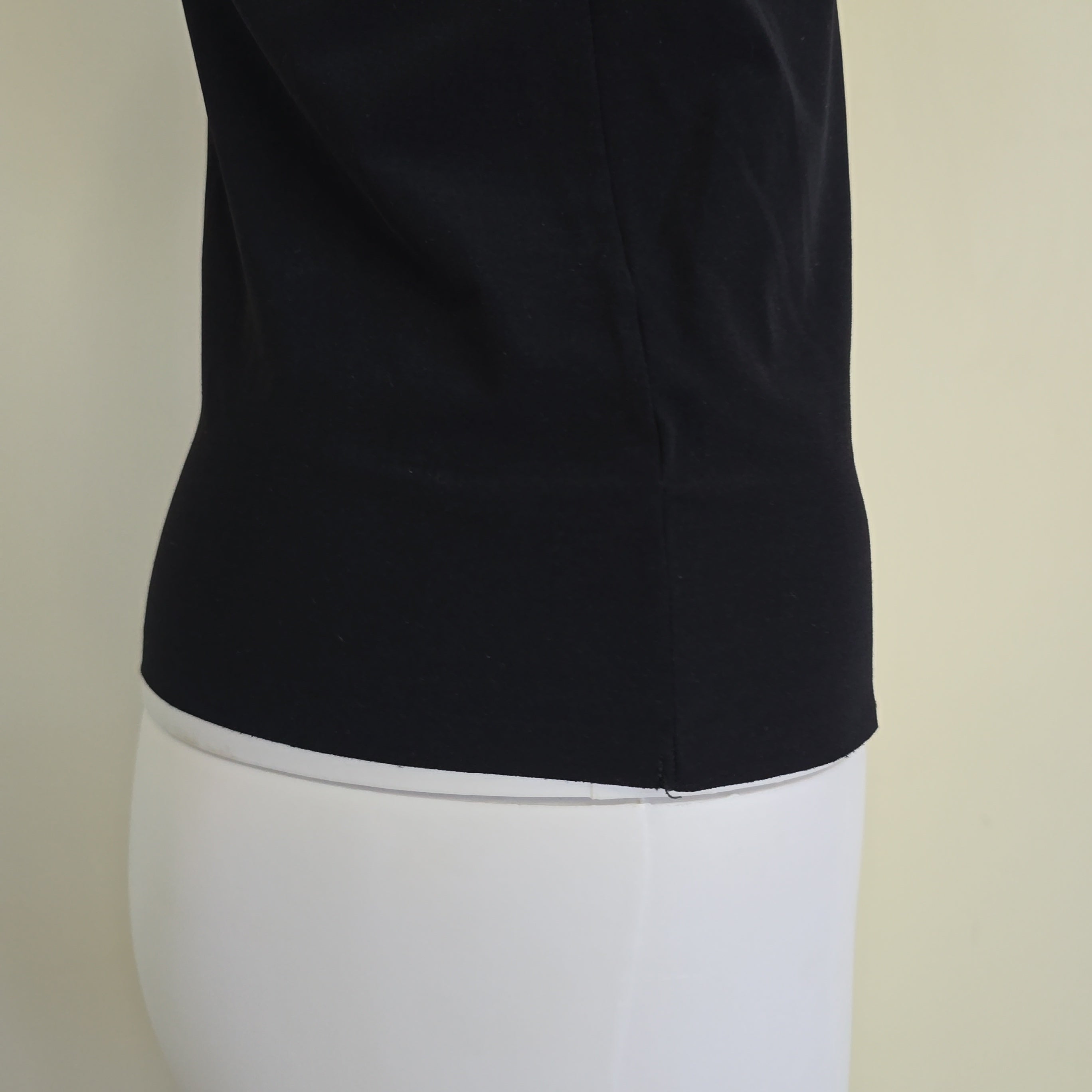 Black tank top on a light background