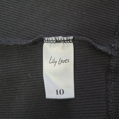 Label on black ribbed fabric with 'Lily Loves' branding