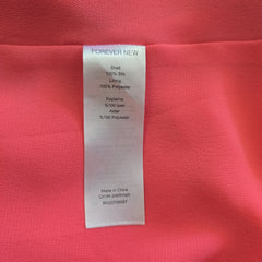 Fabric label on a pink fabric background