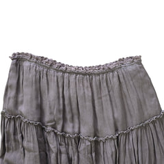 Grey ruffled skirt on a light background