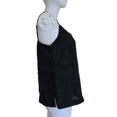Black top on a white mannequin against a light background